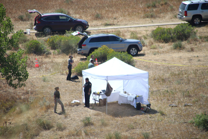Douglas County Sheriff's Office personnel investigate the scene at West Fork Disc Golf Course in Highlands Ranch Thursday, Aug. 27.